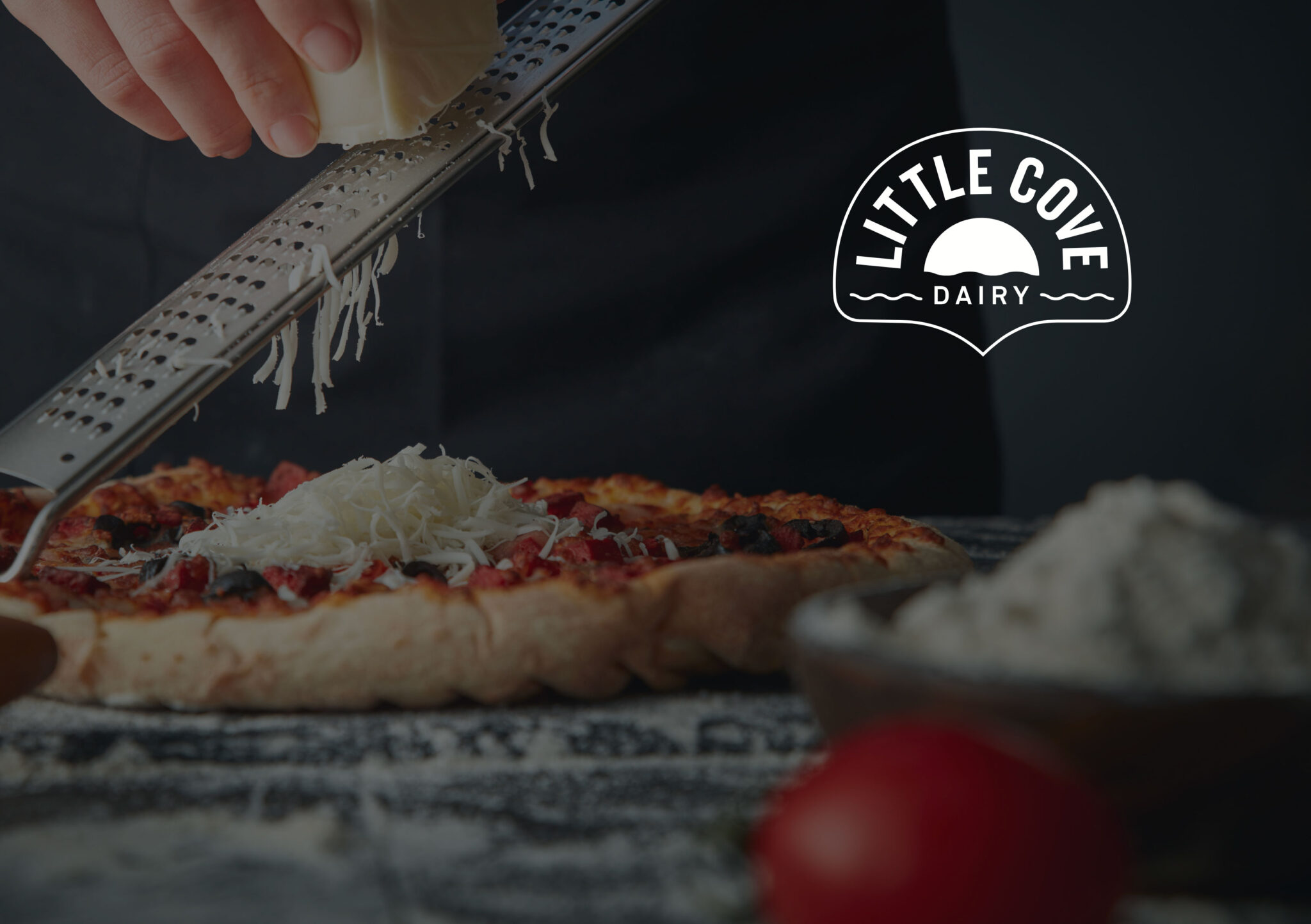 little cove dairy cheese packaging image with grated cheese on pizza